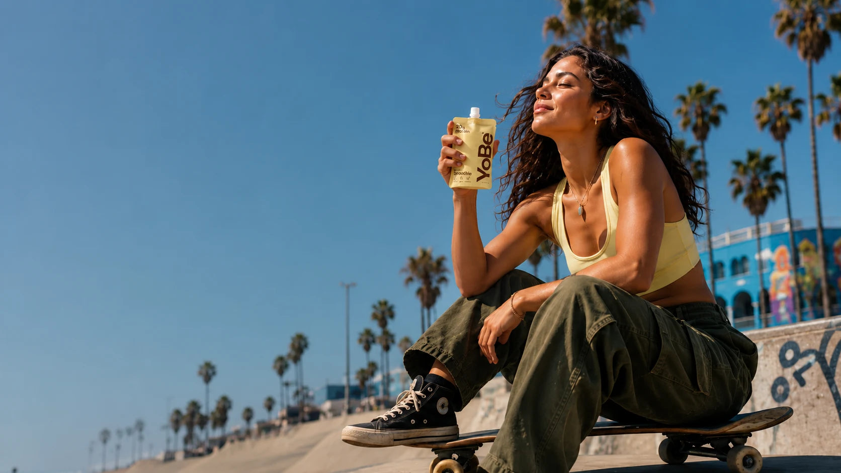 YoBe pouch held in a sunny Venice skate scene